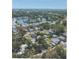 Community overview with lake and houses at 509 Rosery Nw Rd, Largo, FL 33770