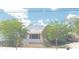 Charming single-story home with lush landscaping, a covered carport, and a well-maintained front yard at 509 Rosery Nw Rd, Largo, FL 33770