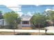 Charming single-story home with lush landscaping, a covered carport, and a well-maintained front yard at 509 Rosery Nw Rd, Largo, FL 33770