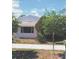 Pink house curb appeal. Landscaped yard at 509 Rosery Nw Rd, Largo, FL 33770