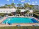 Community pool with lift and lounge chairs at 5920 80Th N St # 101, St Petersburg, FL 33709