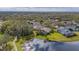 Aerial view of a neighborhood with a lake at 6002 Shearwater Ln, Lithia, FL 33547