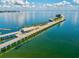 Aerial view of a pier extending into a calm ocean at 615 Newton S Ave, St Petersburg, FL 33701