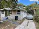 Side view of house needing renovation, showing driveway at 615 Newton S Ave, St Petersburg, FL 33701