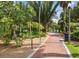 Brick pathway through lush tropical landscaping at 615 Newton S Ave, St Petersburg, FL 33701