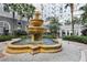 Elegant courtyard fountain with lush tropical plants at 700 S Harbour Island Blvd # 226, Tampa, FL 33602