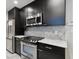 Sleek kitchen boasting dark cabinetry and stainless steel appliances at 700 S Harbour Island Blvd # 226, Tampa, FL 33602