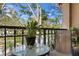 Private balcony overlooking a lush treetop landscape at 809 Normandy Trace Rd, Tampa, FL 33602