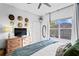 Second bedroom with a king bed and large window at 809 Normandy Trace Rd, Tampa, FL 33602