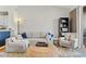 Cozy living room with sectional sofa, accent chair, and a large window at 809 Normandy Trace Rd, Tampa, FL 33602
