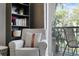 Comfortable living room with arm chair and balcony access at 809 Normandy Trace Rd, Tampa, FL 33602