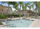 Community water fountain with surrounding landscaping and seating at 809 Normandy Trace Rd, Tampa, FL 33602