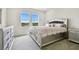 Bright bedroom with a large bed and plenty of natural light at 8126 Muddy Pines Pl, Tampa, FL 33635