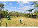 Fenced dog park with agility equipment and shaded seating at 8126 Muddy Pines Pl, Tampa, FL 33635