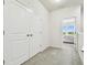 Upstairs hallway with access to bedrooms and additional storage at 8126 Muddy Pines Pl, Tampa, FL 33635