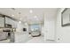 Modern kitchen with gray cabinets, granite counters, and island at 8126 Muddy Pines Pl, Tampa, FL 33635
