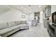 Open floor plan boasts a spacious kitchen with island and modern appliances, adjacent to a comfortable living room at 8126 Muddy Pines Pl, Tampa, FL 33635