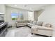 Spacious living room with large sectional sofa and rug at 8126 Muddy Pines Pl, Tampa, FL 33635