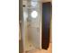 Modern bathroom with glass shower and storage cabinet at 943 Columbia Ter, Port Charlotte, FL 33948
