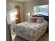 Bedroom with queen size bed, tropical accents and lots of natural light at 943 Columbia Ter, Port Charlotte, FL 33948