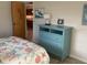 Bedroom with turquoise dresser and coastal decor at 943 Columbia Ter, Port Charlotte, FL 33948