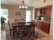 Dining area with wood table and built-in cabinetry at 943 Columbia Ter, Port Charlotte, FL 33948