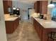 Modern kitchen with wood cabinets and granite countertops at 943 Columbia Ter, Port Charlotte, FL 33948
