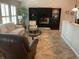 Spacious living room with fireplace and built-in shelving at 943 Columbia Ter, Port Charlotte, FL 33948