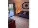 Cozy living room with patterned rug and view of pool at 943 Columbia Ter, Port Charlotte, FL 33948