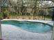 View of an inground pool in screened enclosure at 943 Columbia Ter, Port Charlotte, FL 33948