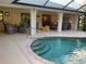 View of the pool with an outdoor entertaining area at 943 Columbia Ter, Port Charlotte, FL 33948