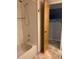 Shower with marble tiled walls at 943 Columbia Ter, Port Charlotte, FL 33948
