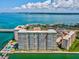 Aerial view of condo building showcasing water access and city views at 5200 Brittany S Dr # 1204, St Petersburg, FL 33715