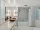 Bathroom with granite countertop, mosaic tile, and shower/tub combo at 5200 Brittany S Dr # 1204, St Petersburg, FL 33715
