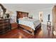 Main bedroom with hardwood floors and large wood furniture at 5200 Brittany S Dr # 1204, St Petersburg, FL 33715