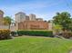 Community entrance with lush landscaping and signage at 5200 Brittany S Dr # 1204, St Petersburg, FL 33715