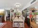 Elegant dining room with granite table and hardwood floors at 5200 Brittany S Dr # 1204, St Petersburg, FL 33715