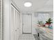 Bright entryway with built-in storage and tile flooring at 5200 Brittany S Dr # 1204, St Petersburg, FL 33715