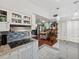 Open kitchen with granite island, white cabinets, and view to dining area at 5200 Brittany S Dr # 1204, St Petersburg, FL 33715