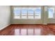 Bright living room with hardwood floors and stunning water views at 5200 Brittany S Dr # 1204, St Petersburg, FL 33715