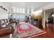 Spacious living room with hardwood floors, fireplace, and large TV at 5200 Brittany S Dr # 1204, St Petersburg, FL 33715