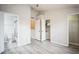 Bright bedroom with laminate flooring and a walk-in closet at 10157 Bessemer Pond Ct, Riverview, FL 33578