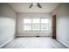 Bedroom with large windows overlooking a tranquil lake at 10157 Bessemer Pond Ct, Riverview, FL 33578