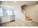 Modern kitchen with island and staircase leading upstairs at 10157 Bessemer Pond Ct, Riverview, FL 33578