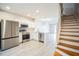 Modern kitchen with island and staircase leading upstairs at 10157 Bessemer Pond Ct, Riverview, FL 33578