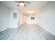 Spacious living room with vinyl flooring and ceiling fan at 10157 Bessemer Pond Ct, Riverview, FL 33578