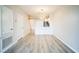 Bright living room with vinyl flooring and access to kitchen at 10157 Bessemer Pond Ct, Riverview, FL 33578