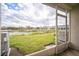 Enjoy the view from this screened patio overlooking a lake at 10157 Bessemer Pond Ct, Riverview, FL 33578