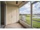 Screened patio with access to backyard and lake views at 10157 Bessemer Pond Ct, Riverview, FL 33578