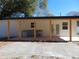 Covered patio with outdoor kitchen and spacious yard at 10322 N Oakleaf Ave, Tampa, FL 33612